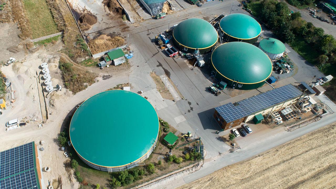 Aerial view of multiple anaerobic digesters representing biogas services