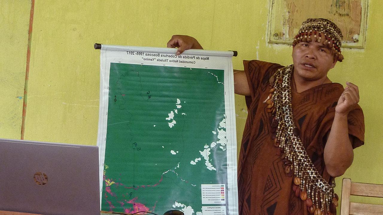 A member of the Yamino Native Community forest governance body in Ucayali, Peru, presents during a community meeting