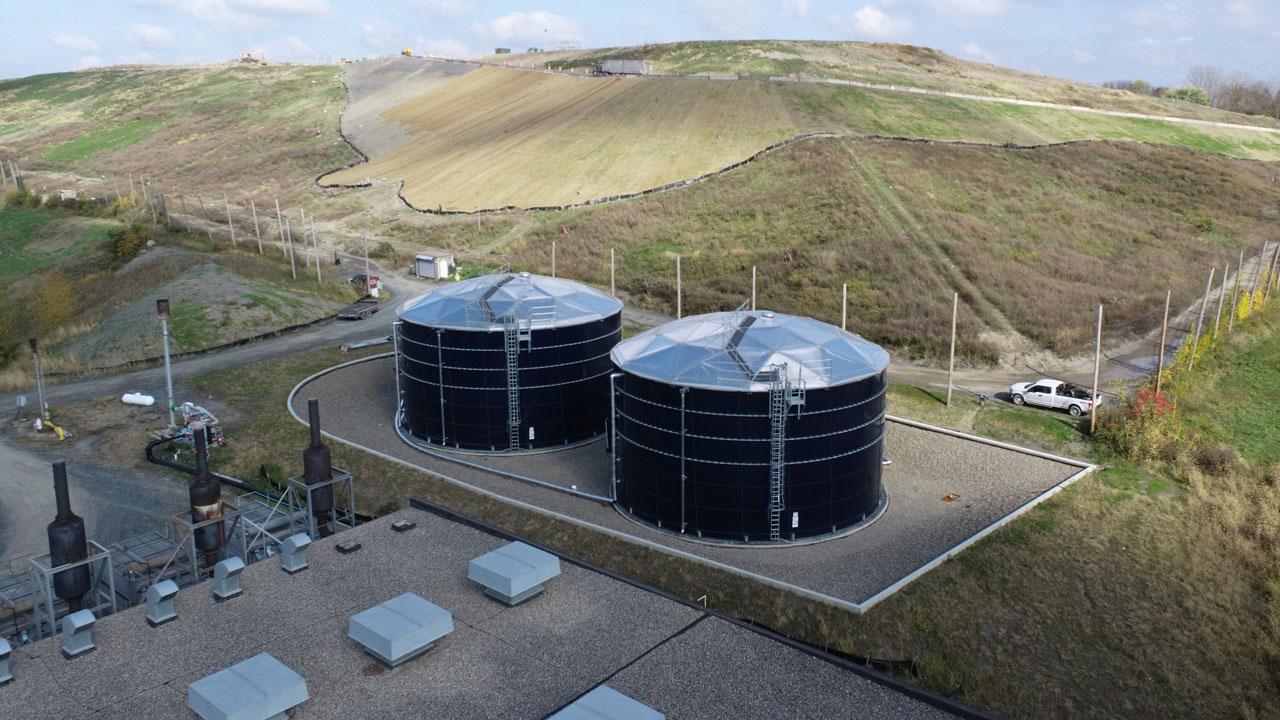Aerial view of two leachate storage tanks with secondary containment