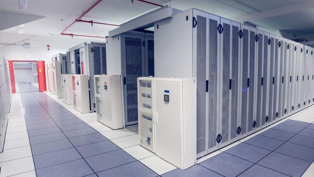 A long hallway with data processors
